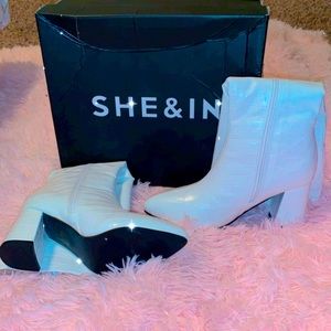 “”White crocodile skin wedged boots”